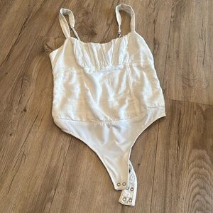 I’m selling a white bodysuit.